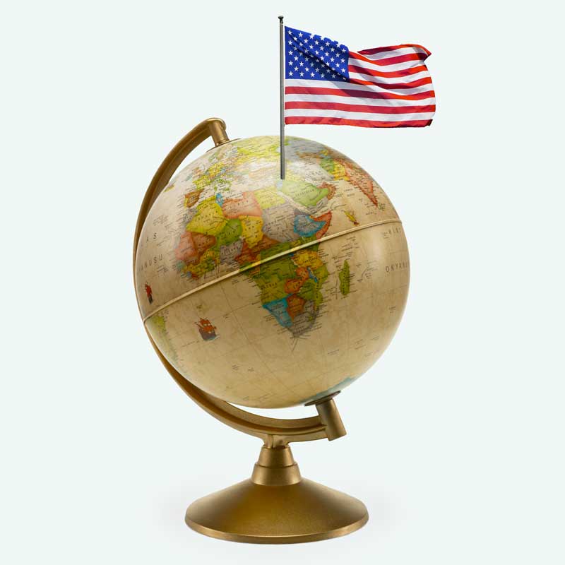 A globe with a U.S. flag stuck in the Middle East